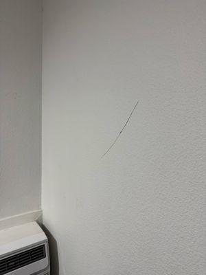 Cracks throughout the wall