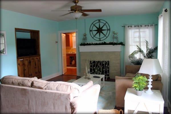 Living room with kitchen in background.