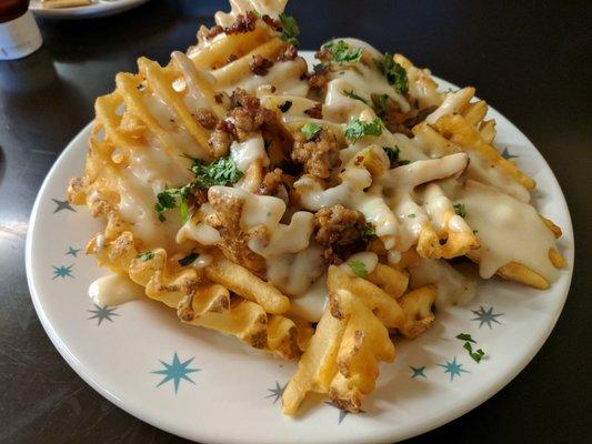 Waffle Fries w/ Pepper Jack cheese sauce, chorizo, & cilantro