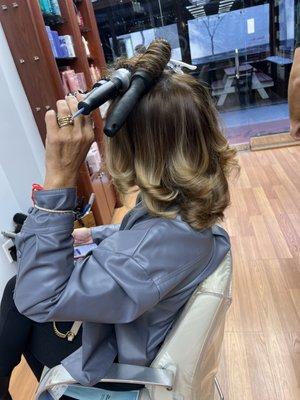 Color and highlights and finishing touch cut and blow dry.