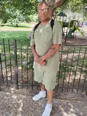 Joe Wells on the side of the doggy park which is across the street from the downtown library.