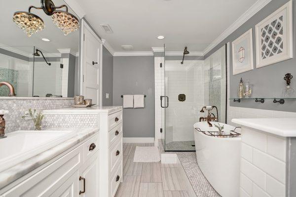 Frameless shower glass and bathroom mirror