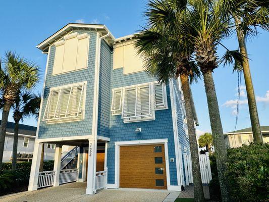 Beautiful home on Wrightsville Beach featuring aritculating bahama shutters and rolldowns (both electric and manual)