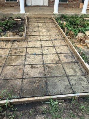 Concrete walkway! A great way to transform your curb appeal.