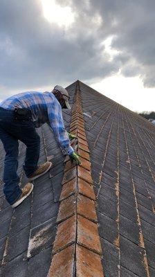 Inspecting an old Slate Roof. This roof is original from the 1960's. It's served its purpose and is about ready for replacement.