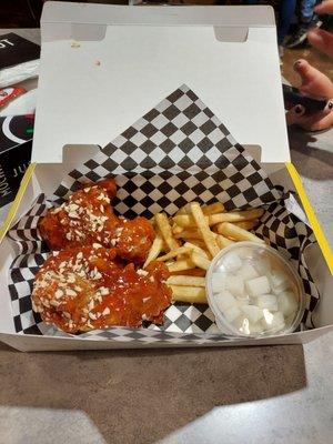 Chicken thigh (Korean sweet & spicy sauce + almonds) lunch combo with fries.