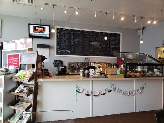 Menu board and display of goodies.