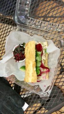 Bahn Mi on rustic French bread. Served with a very tasty pickled slaw of beets and kale.