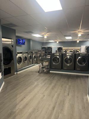 Clean laundromat with on-site attendants