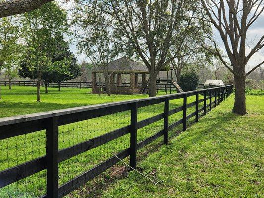 Coral (3-rail) fence with wire.