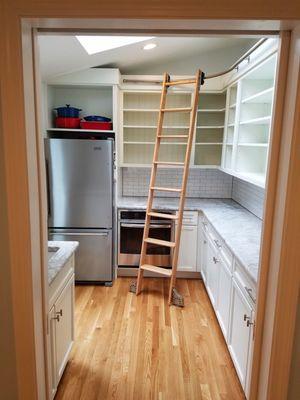 Custom kitchen cabinets for pantry. White cabinets with kitchen shelves and rolling ladder!