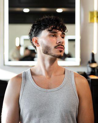 Taper haircut & beard.