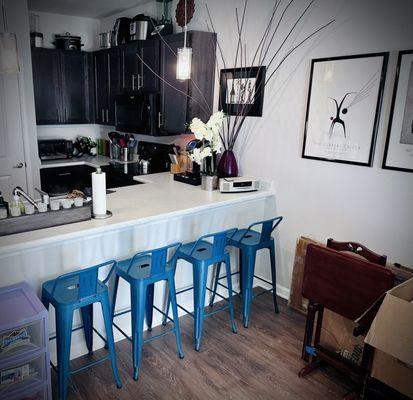 I decided to omit an actual "dinning area" and bought four bar stools and no table.