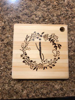 My final product with my own design on a cutting board/charcuterie board!