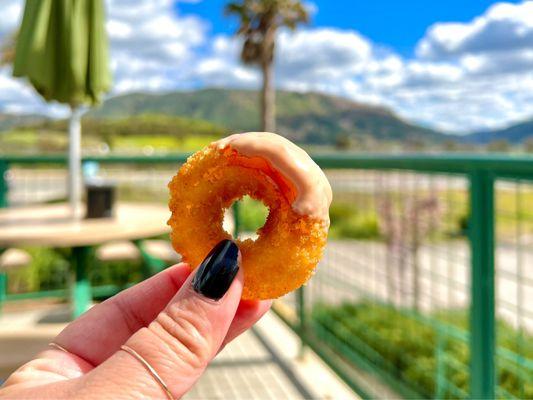 Onion ring dipped in homemade thousand island sauce.