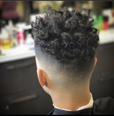 All around fade with sponge enhanced highlighted curls