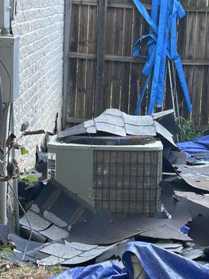 Roofing tiles thrown from two stories up onto my air conditioner unit denting it up.