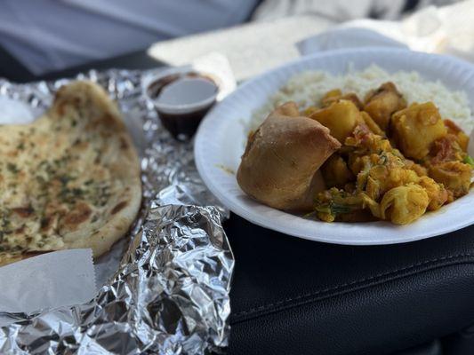 Aloo Gobi, samosas, naan bread and basmati rice we usually stop here at this stop on the way home to get the delicious Indian food.