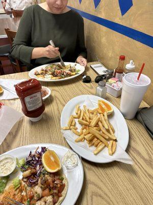 Shrimp tacos, steak fries