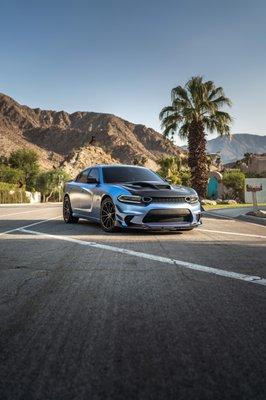 Dodge charger Fully wrap in frozen chrome blue with custom graphics.