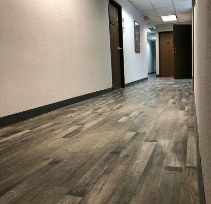 Rancho Cordova, CA Commercial building: Carpet removal, Vinyl Plank and new rubber base Install