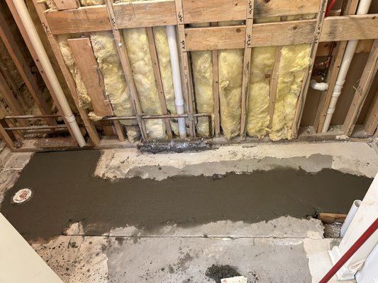 Relocate drain lines on a slab house and patch concrete