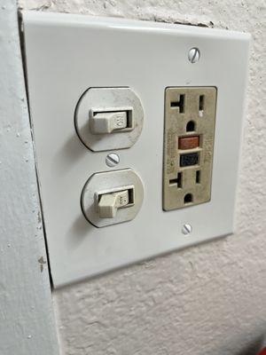 Beige power outlet, white light/fan switches, white cover