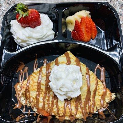 Kiki's Stuffed Krepes (stuffed with strawberries, bananas, and nutella.)