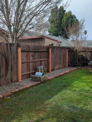 Installed metal posts with redwood box details