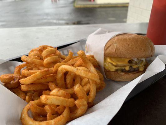 Curly fries and onion burger.