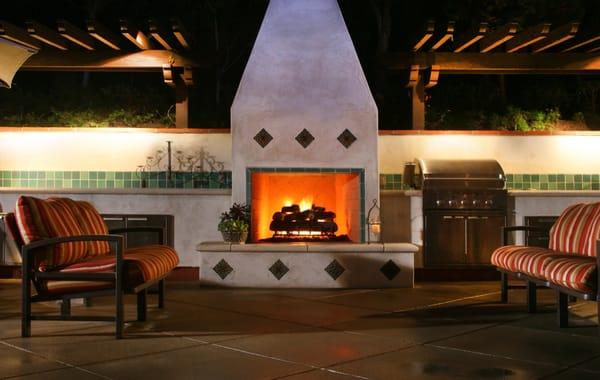 Outdoor Fire Place with a Barbeque Counter and Wood Arbor