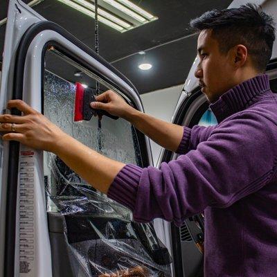 Tony installing Ceramic Window Tint on a Semi-Truck