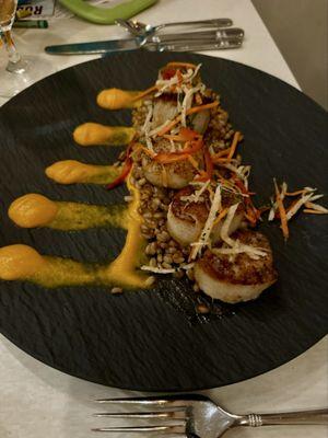 Scallops with a jicama slaw, barley , and a carrot purée.