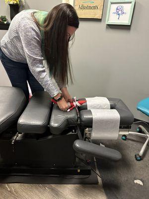 Dr. Ashley adjusting our Elf on the Shelf.