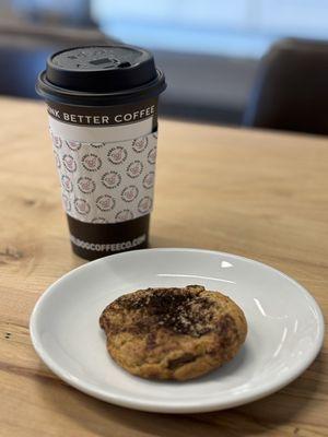 Espresso chocolate chip cookie with a cup of pistachio cream coffee.