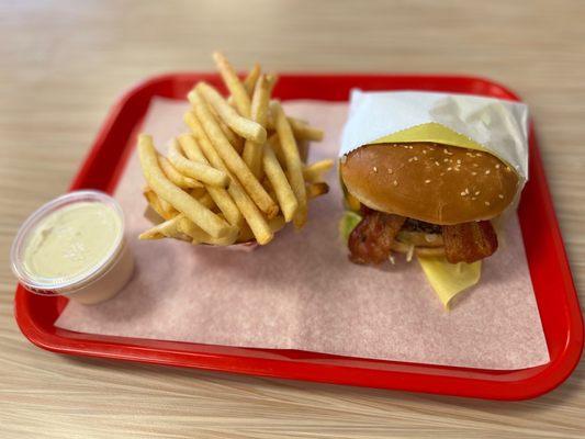 Avocado bacon cheeseburger with fries and a side of ranch