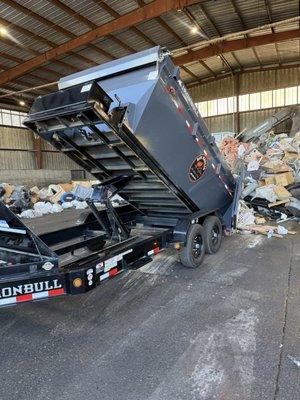 Emptying a load of trash from a happy customer