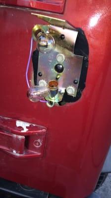 Taillight ripped off and paint chipped from car wash