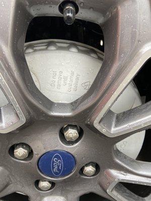 Factory Plastic covering brakes and rotors, supposed to be removed before being driven to avoid fire