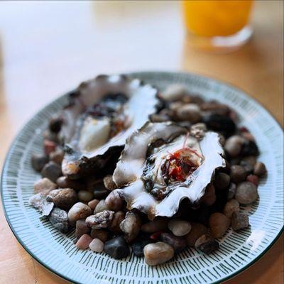 Special fresh oysters from the Pacific Northwest with ogo and charcoal.