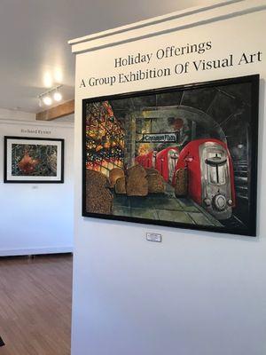 Image from the December 2023 exhibition showing a few paintings by Richard H. Eyster.