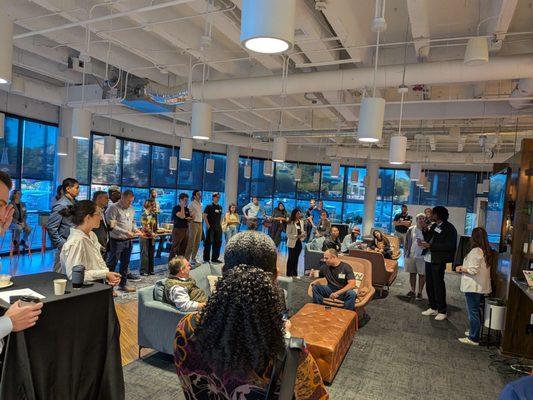 Entrepreneurs and investors gathering in the meeting place on main level