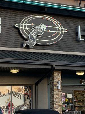 There's legit a space man with a drink in his hand on this building lol