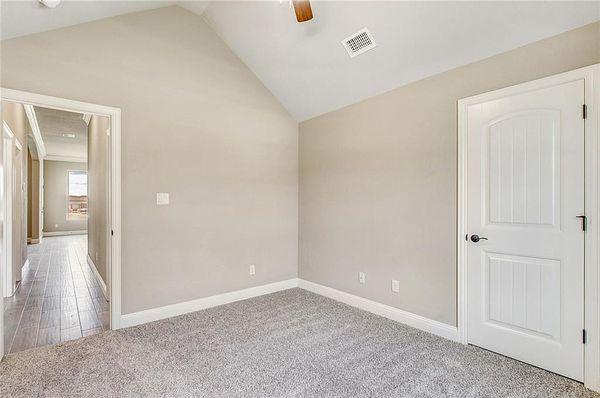 Tiled hall way leading to the 3rd bedroom