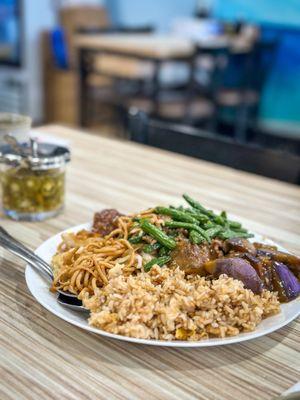 Combo with egg plant, orange chicken and string beans