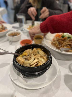 V10. Caramelized mushrooms and tofu in clay pot served with rice