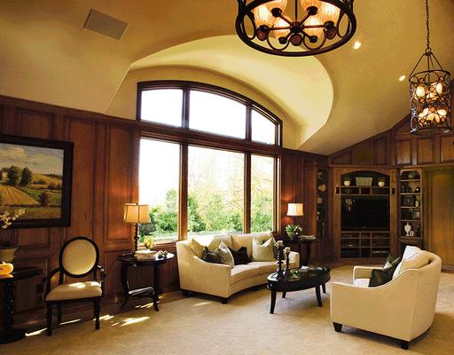 Specialty Windows mulled together into one large picture window unit with beautiful wood interiors.