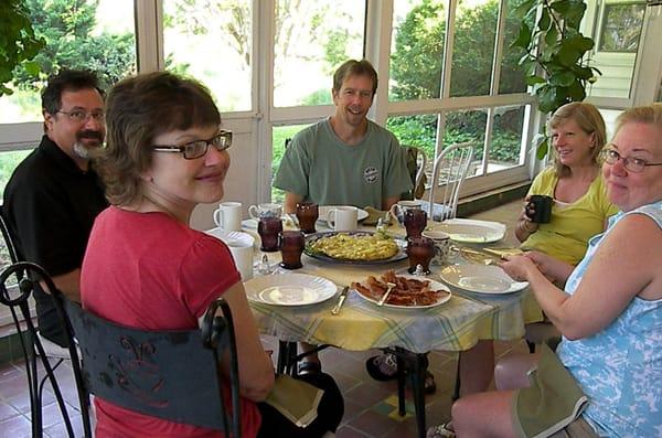 Breakfast group enjoying an artichoke-potato frittata and more