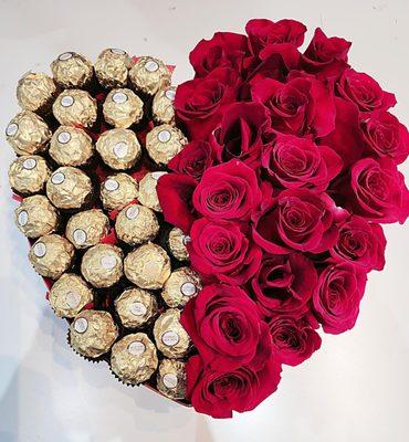 Heart shape boxes with roses and chocolates