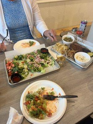 A salad mixed with the 3 meat plate